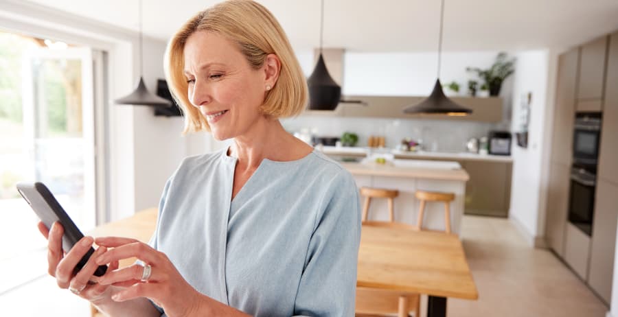 Resident with mobile device in a stylish home